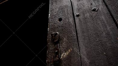 Old brown door. Old wooden door opens.