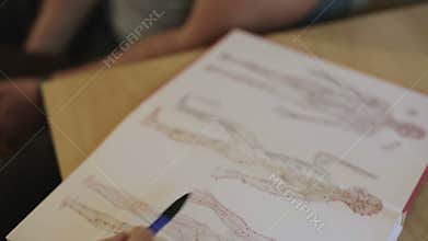 Doctor explains patient appointment acupuncture points.