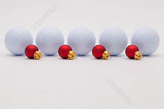 Golf balls and red Christmas decoration