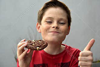 Boy enjoys pastry