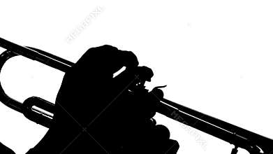 Silhouette hands of men play on the buttons trumpet. Close