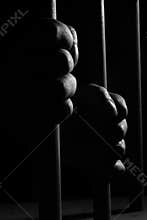 Hands holding bars