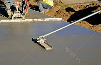 Leveling wet concrete