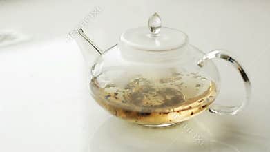 Brew tea in a glass tea pot.