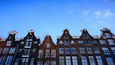 Slow motion video of view from the canal to the streets, canals with old flamish houses and bridges in Amsterdam