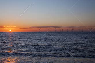 Renewable energy - offshore wind farm at dawn