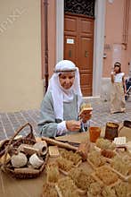Brush maker on the medieval market
