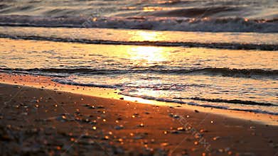 Calm sea and shore at sunrise or sunset