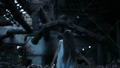 Ghost girl in abandoned building. industrial premises