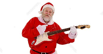 Santa claus singing a song and playing guitar