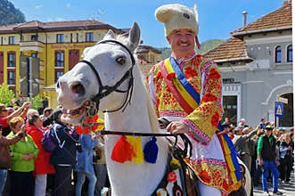 Man on the horse, in traditional national costume, at the parade - Celebration Days of Brasov City, landmark attraction in Romania
