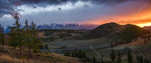 Altai, Ukok plateau. Beautiful sunset with mountains in the background. Snowy peaks autumn. Journey through Russia, Altay