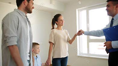 Happy family and realtor at new house or apartment