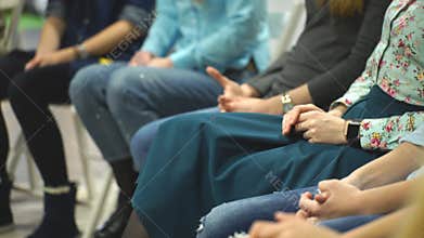 Women sitting in circle during session with psychologist