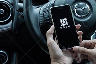 CHIANG MAI,THAILAND - JUNE 15, 2017 : A uber driver hand holding