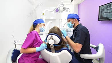 Medical Team Treating Patient at Dental Clinic