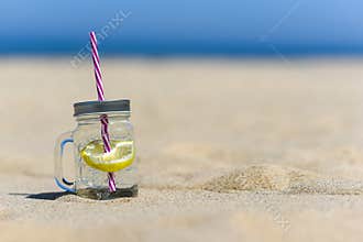 Lukecin, Poland, June 15, 2017: Cold drink in jar on the beach w
