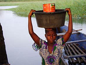 African woman at the river