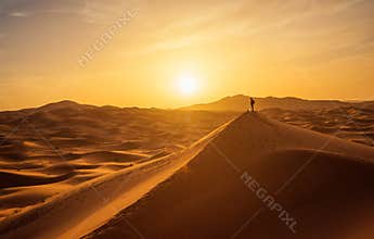 Lonely man in Sahara Desert