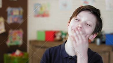 Portrait of a cute little boy laughing looking at the camera