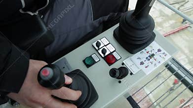 Cabin to control the crane. View from the crane operator working place. Gantry crane operator moving a sea container