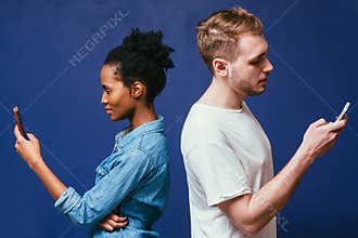 Technology separate people. Man, woman with phone