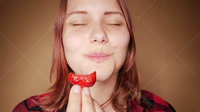 Young girls eating strawberry