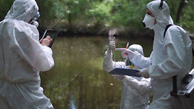 Three bio technicians testing for pollutants