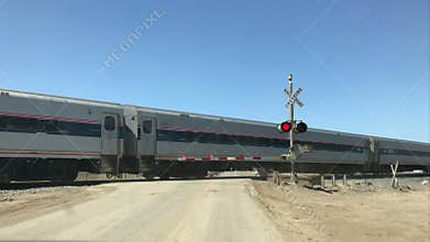 Amtrak train crossing in central California, USA