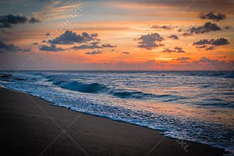 Caribbean sunset and a lonely surfer