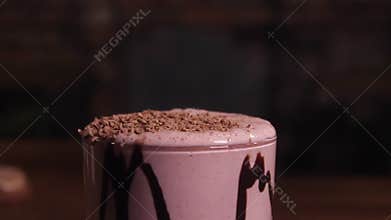 Milkshake, sprinkled with chocolate chips.