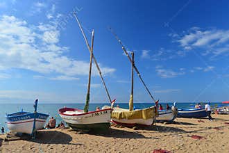 Old colourfull wooden sailboats or fishboats on the beachn Pineda de Mar, Spain