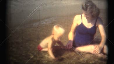 (1950's 8mm Vintage) Mom and Toddler Having Fun At Beach