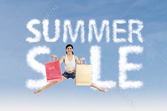 Woman make summer sale sign