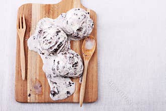 Homemade cookie and cream ice cream scoop melting