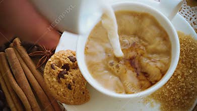 Coffee being poured into coffee cup