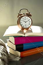 Bedtime reading, alarm clock and books