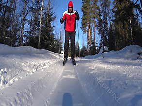 Cross country skiing man approaching