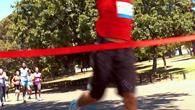 In high quality format fit people running race in park