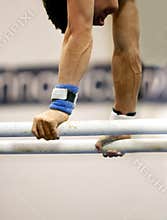 Gymnast on parallel bars