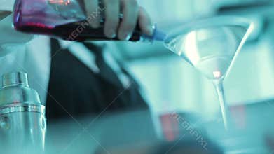 Woman making a Martini with Litchi