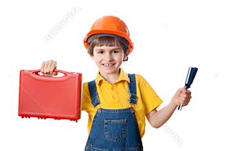 Happy six-year-old boy dressed as construction worker with tools kit