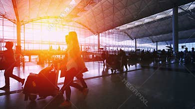 Sunset Silhouettes of Travelers in Airport.
