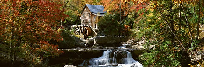 Panoramic of Glade Creek Grist Mil and autumn reflections and waterfall in Babcock State Park, WV