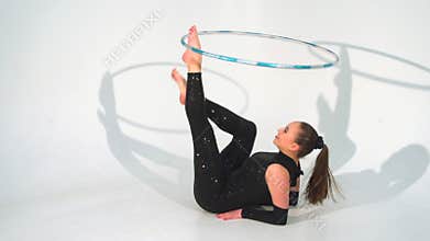 Spinning acrobat beautiful hula hoops in slow motion