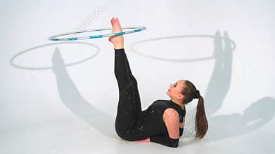 Spinning acrobat beautiful hula hoops in slow motion