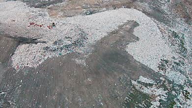 Aerial Shot Landfill with Working Trucks and Tractor