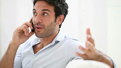 Young man talking on phone