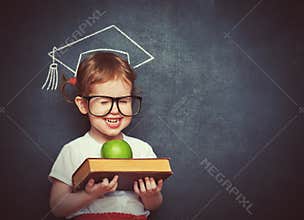 Girl schoolgirl with books and apple in a school board