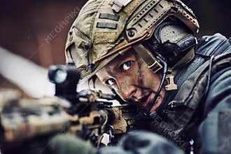 Armed woman in camouflage with sniper gun